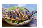 Grilled nila fish, served with banana leave by Anonymous