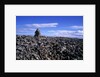 Stacked rock sculpture among rocky coastline. by Anonymous