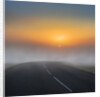 Empty road with fog and sunset. by Anonymous