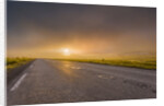 Empty road with fog and sunset. by Anonymous