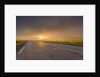 Empty road with fog and sunset. by Anonymous