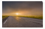 Empty road with fog and sunset. by Anonymous