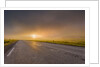 Empty road with fog and sunset. by Anonymous