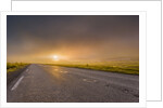 Empty road with fog and sunset. by Anonymous