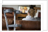 Woman watching TV with crutches by Anonymous