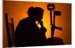 Woman seated with crutches by Anonymous