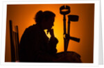 Woman seated with crutches by Anonymous