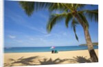 Vacationing couple's beach chair and umbrella on Hulupo'e Beach; Manele Bay; Lanai; Hawaii by Anonymous