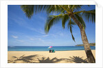 Vacationing couple's beach chair and umbrella on Hulupo'e Beach; Manele Bay; Lanai; Hawaii by Anonymous