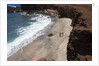 Couple walking on secluded beach at Shark's cove, Lanai, Hawaii MR by Anonymous