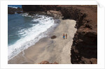 Couple walking on secluded beach at Shark's cove, Lanai, Hawaii MR by Anonymous
