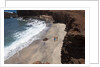 Couple walking on secluded beach at Shark's cove, Lanai, Hawaii MR by Anonymous