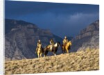 Cowboys and Cowgirls riding along the hills of the Big Horn Mountains by Anonymous