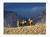 Cowboys and Cowgirls riding along the hills of the Big Horn Mountains by Anonymous