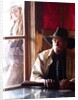Cowboy with rifle and Cowgirl looking over his shoulder by Anonymous