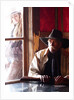 Cowboy with rifle and Cowgirl looking over his shoulder by Anonymous