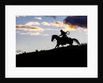 Cowboy in silhouette with sunset by Anonymous