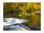 Trees reflect in cascade above Bond Falls on the Middle Fork of the Ontonagon river near Paulding in by Anonymous