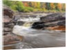 Bonanza Falls, where the Iron river glides over smooth slanted rocks. by Anonymous