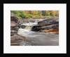 Bonanza Falls, where the Iron river glides over smooth slanted rocks. by Anonymous