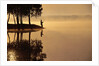 Man Fishing at Lake by Anonymous