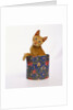 Kitten Sitting in Flowered Cookie Tin by Anonymous