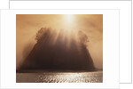 Sun Beams Breaking through Fog over Sea Stack by Anonymous