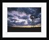 Windmill Silhouette Under Broken Clouds by Anonymous