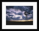 Windmill Silhouette Under Broken Clouds by Anonymous
