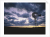 Windmill Silhouette Under Broken Clouds by Anonymous