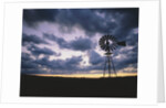 Windmill Silhouette Under Broken Clouds by Anonymous