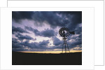 Windmill Silhouette Under Broken Clouds by Anonymous