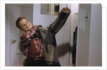 Boy Putting on His Jacket by Anonymous