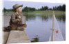 Boy Sitting by Lake in Cowboy Hat by Anonymous