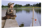 Boy Sitting by Lake in Cowboy Hat by Anonymous