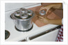 Woman Sterilizing Jars for Canning by Anonymous