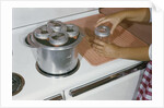 Woman Sterilizing Jars for Canning by Anonymous