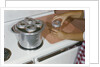 Woman Sterilizing Jars for Canning by Anonymous