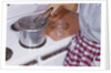 Woman Sterilizing Jars for Canning by Anonymous