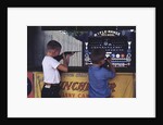 Children Firing Air Rifles at Fair Booth by Anonymous
