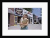 Girl Carrying Paper Shopping Bags by Anonymous