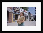 Girl Carrying Paper Shopping Bags by Anonymous