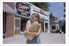 Girl Carrying Paper Shopping Bags by Anonymous