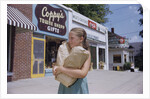 Girl Carrying Paper Shopping Bags by Anonymous