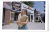 Girl Carrying Paper Shopping Bags by Anonymous