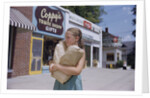 Girl Carrying Paper Shopping Bags by Anonymous