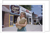 Girl Carrying Paper Shopping Bags by Anonymous