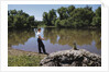 Boy Fishing with Stick and Can of Worms by Anonymous