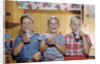 Happy Children Enjoying Glass of Cold Milk by Anonymous