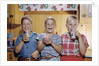 Happy Children Enjoying Glass of Cold Milk by Anonymous